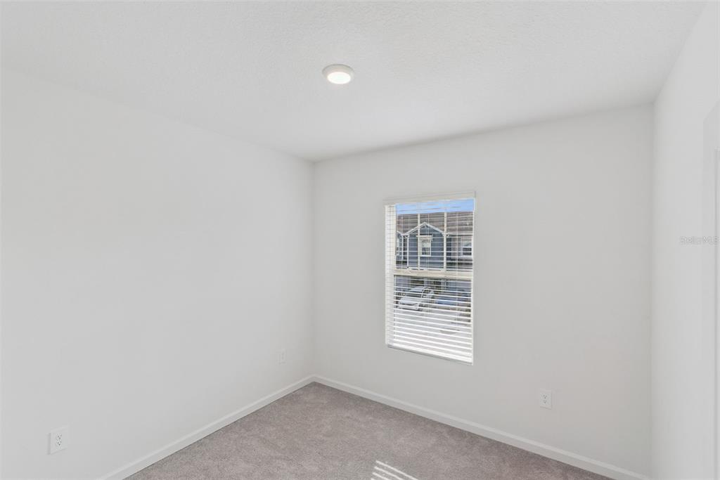 2653 Skyline Loop Kissimmee, FL 34758 - Photo 26 of 42 a view of an empty room with a window