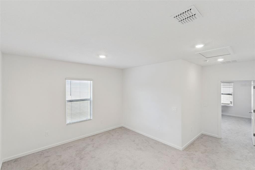 2653 Skyline Loop Kissimmee, FL 34758 - Photo 31 of 42 an empty room with windows and closet