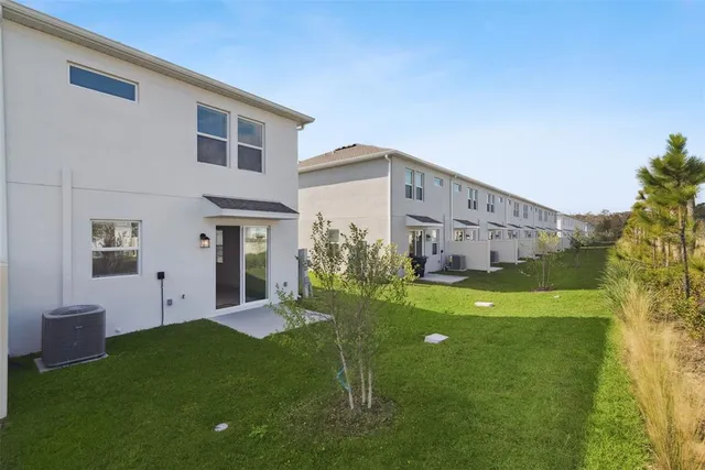 an aerial view of a house with a garden space