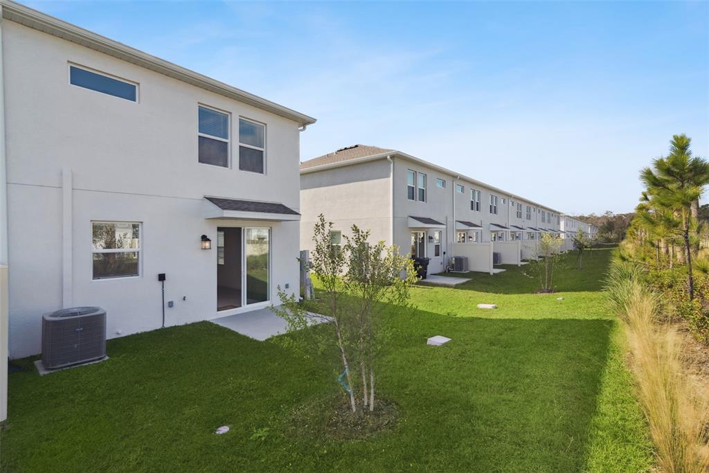2653 Skyline Loop Kissimmee, FL 34758 - Photo 34 of 42 a view of a house with a yard