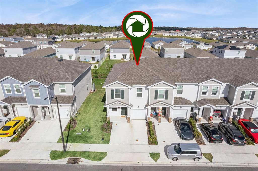 2653 Skyline Loop Kissimmee, FL 34758 - Photo 36 of 42 an aerial view of a house with a garden space