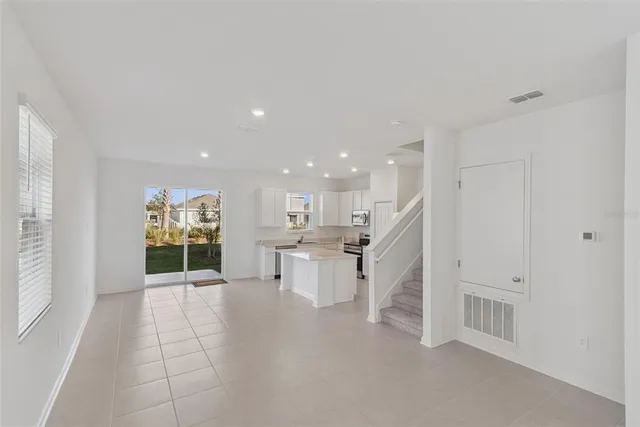 a view of a kitchen with furniture and window