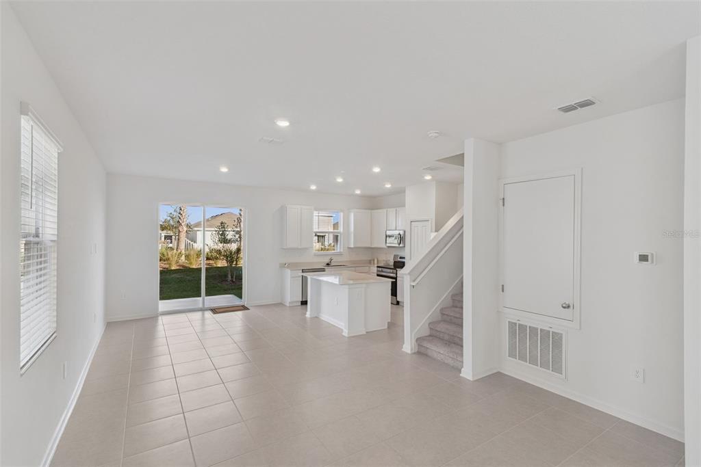 2653 Skyline Loop Kissimmee, FL 34758 - Photo 7 of 42 a view of a kitchen with furniture and window