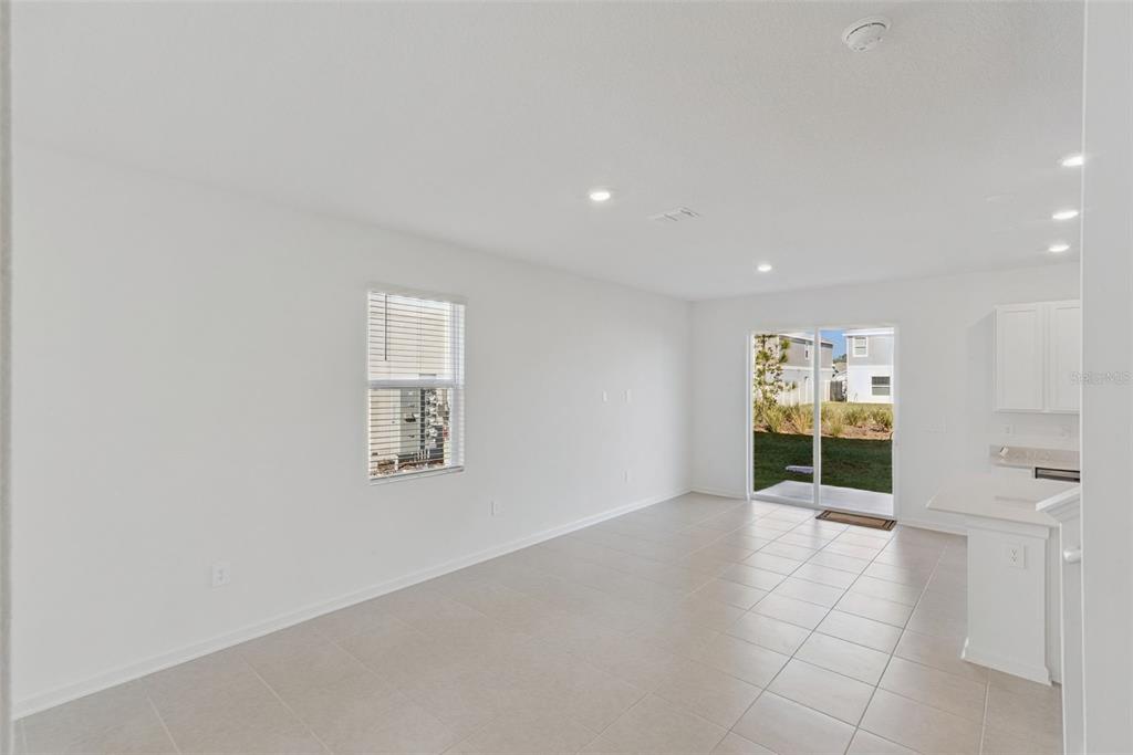 2653 Skyline Loop Kissimmee, FL 34758 - Photo 9 of 42 an empty room with windows and entrance