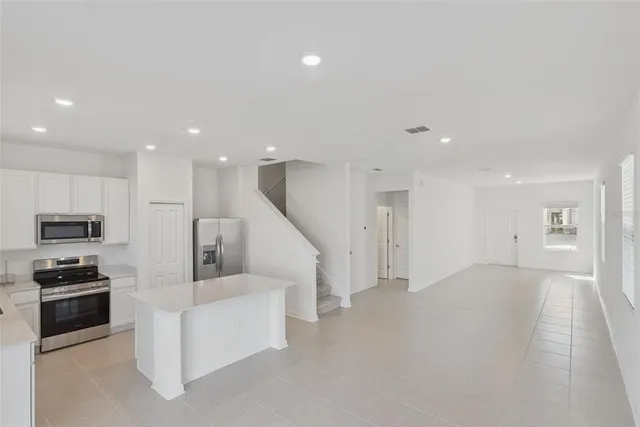 a view of kitchen with microwave and stove