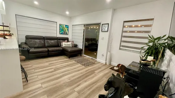 a bedroom with furniture and a chandelier