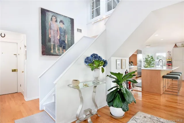 a view of balcony with furniture and flowers