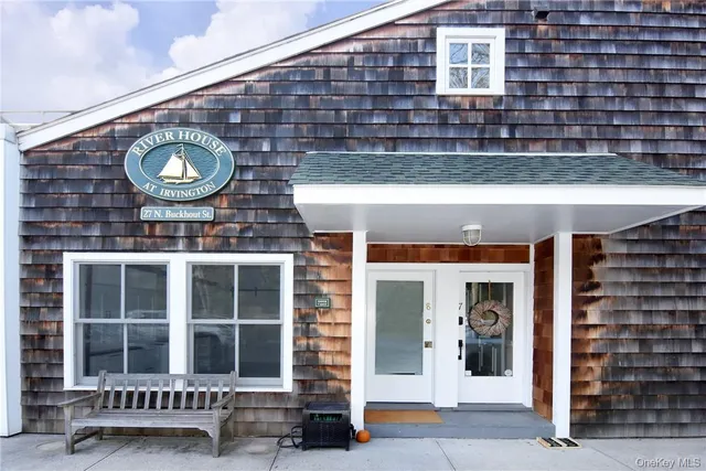 a view of a building with a door and a window