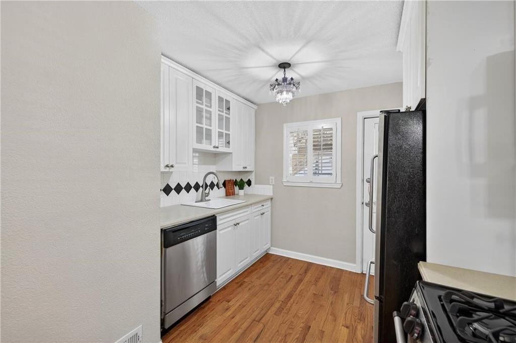1879 Johnson Road Northeast, Unit 3 Atlanta, GA 30306 - Photo 13 of 38 a view of a kitchen with electric appliances