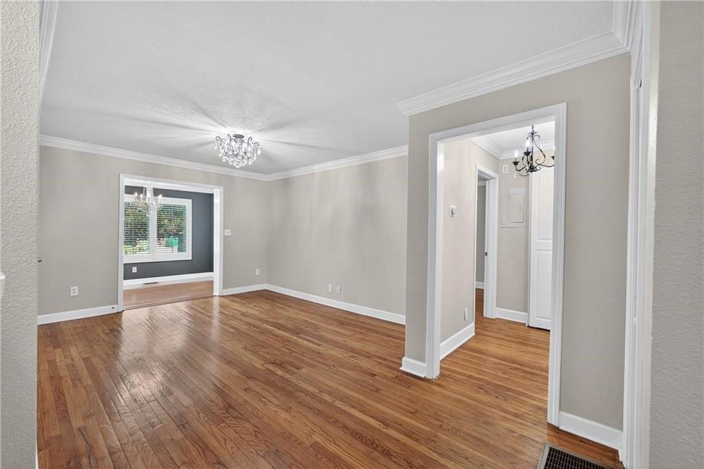 1879 Johnson Road Northeast, Unit 3 Atlanta, GA 30306 - Photo 16 of 38 a view of an empty room with wooden floor and a window