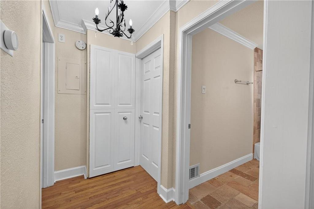 1879 Johnson Road Northeast, Unit 3 Atlanta, GA 30306 - Photo 17 of 38 a view of a chandelier in hallway with wooden floor