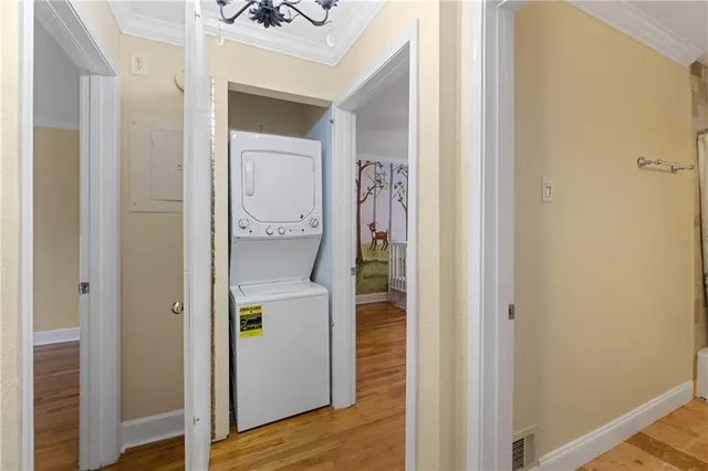 a view of an entryway with wooden floor