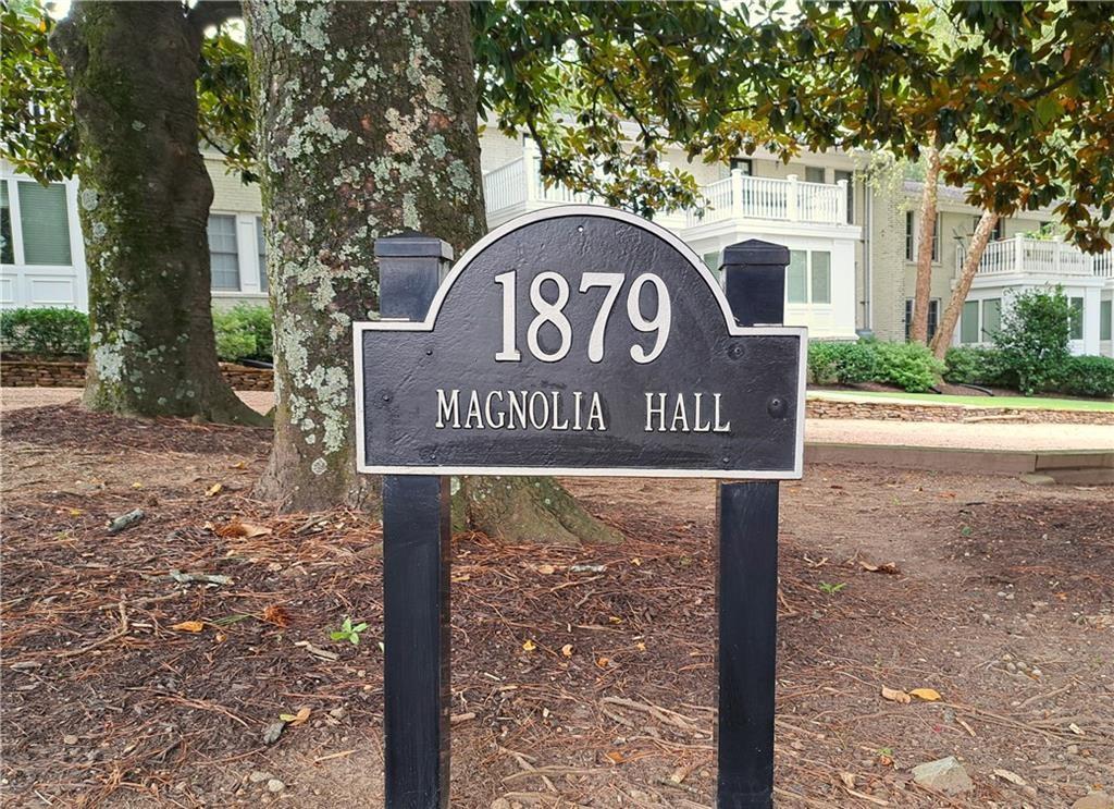 1879 Johnson Road Northeast, Unit 3 Atlanta, GA 30306 - Photo 2 of 38 a sign broad in front of a road