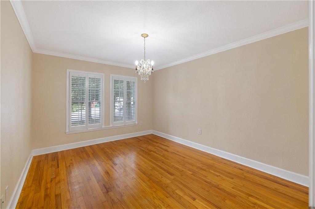 1879 Johnson Road Northeast, Unit 3 Atlanta, GA 30306 - Photo 21 of 38 a view of an empty room with wooden floor and a window