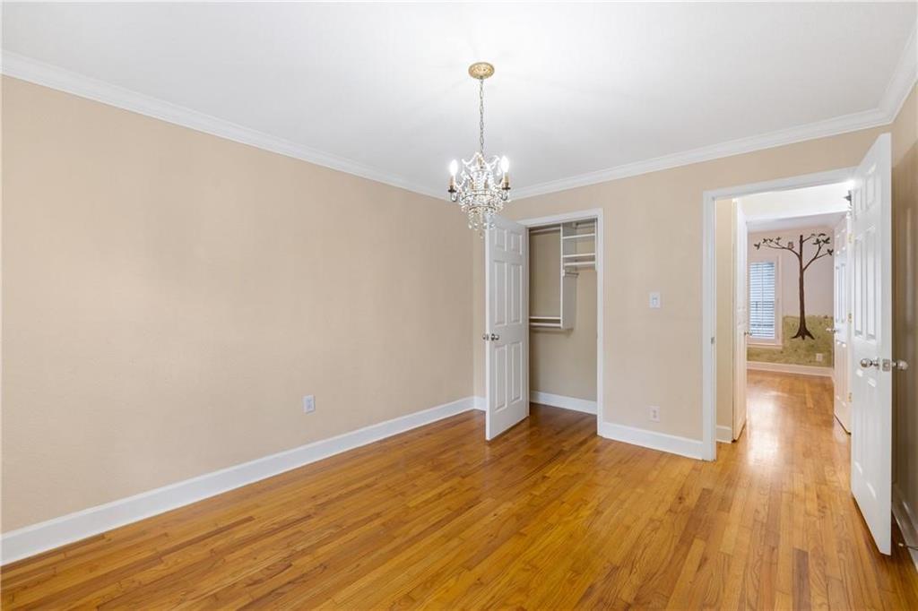 1879 Johnson Road Northeast, Unit 3 Atlanta, GA 30306 - Photo 24 of 38 wooden floor in an empty room with a window