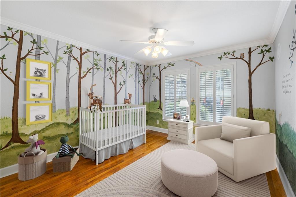 1879 Johnson Road Northeast, Unit 3 Atlanta, GA 30306 - Photo 26 of 38 a bedroom with furniture and wooden floor
