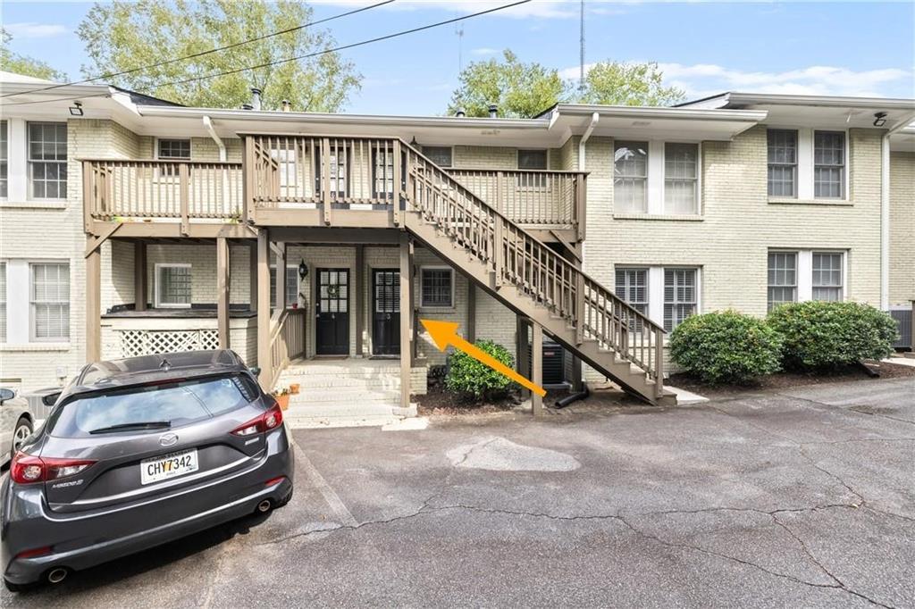 1879 Johnson Road Northeast, Unit 3 Atlanta, GA 30306 - Photo 30 of 38 a front view of a house with a garden