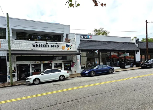 a view of street with parked cars