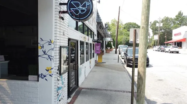 a view of path along with retail shop and buildings
