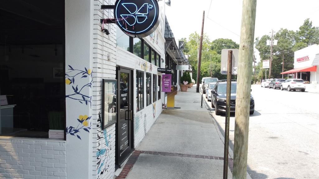 1879 Johnson Road Northeast, Unit 3 Atlanta, GA 30306 - Photo 37 of 38 a view of path along with retail shop and buildings