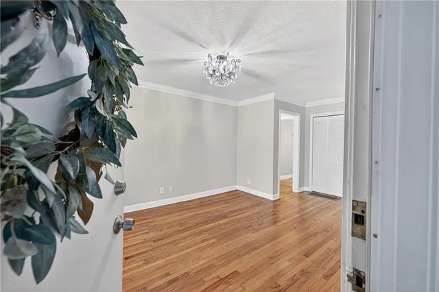 a view of an entryway with wooden floor