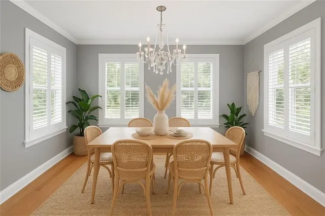 a view of a dining room with furniture window and outside view