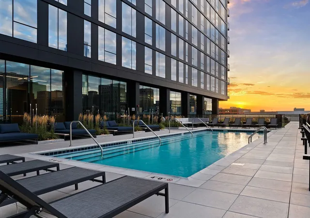 a view of a swimming pool with sitting area