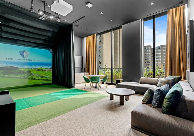 a living room with patio couches and a dining table with garden view