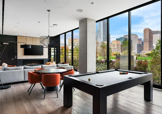 a view of a workspace with furniture and window