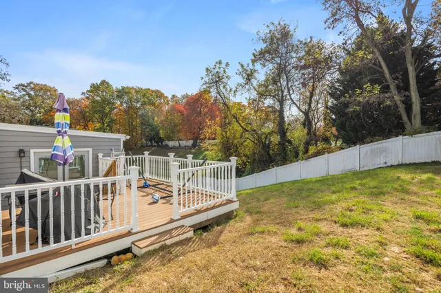 a view of a balcony with yard