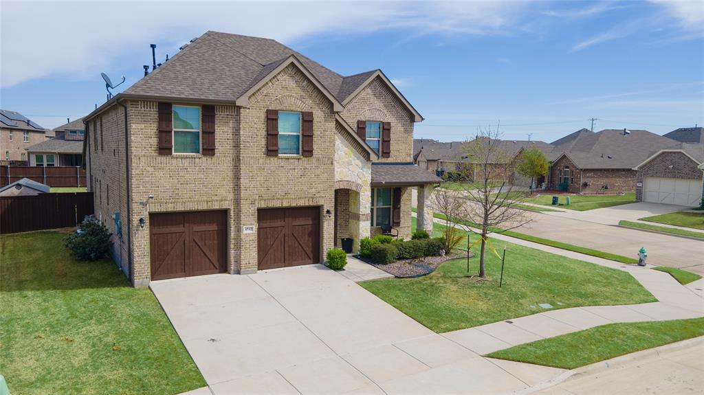 4542 Kipling Avenue Aubrey, TX 76227 - Photo 30 of 34 a front view of a house with a yard and garage