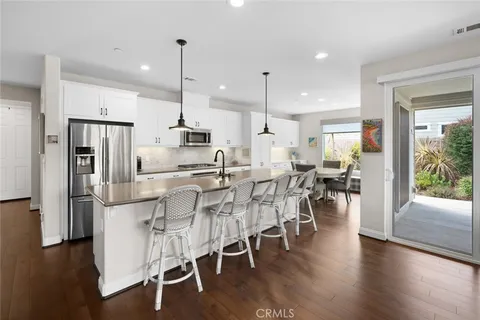 a kitchen with a stove a sink and a microwave