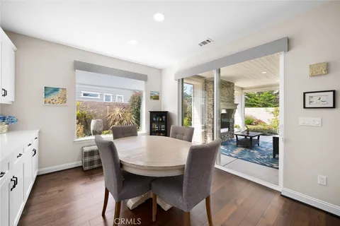 a outdoor living space with furniture potted plant and a fireplace
