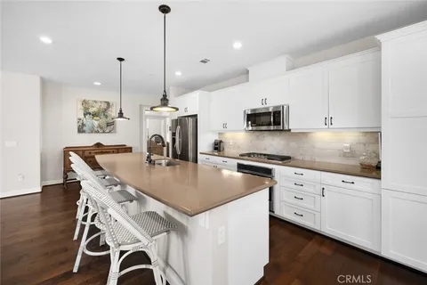 a spacious bedroom with a bed and a window