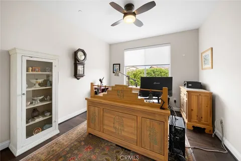 a bedroom with furniture and flat screen tv