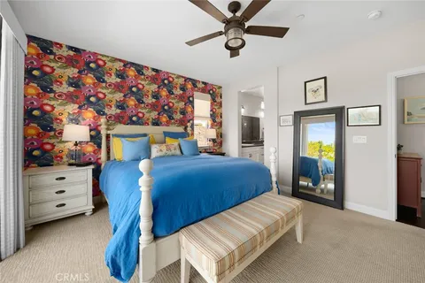 a bathroom with a sink a toilet a mirror a bathtub and shower