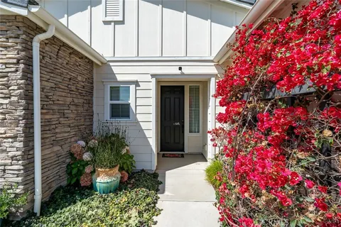 a kitchen with counter top space a sink appliances and cabinets