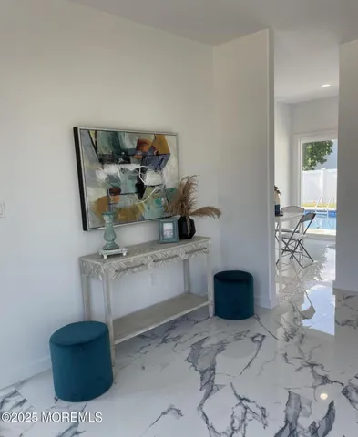 a living room with furniture and flowers