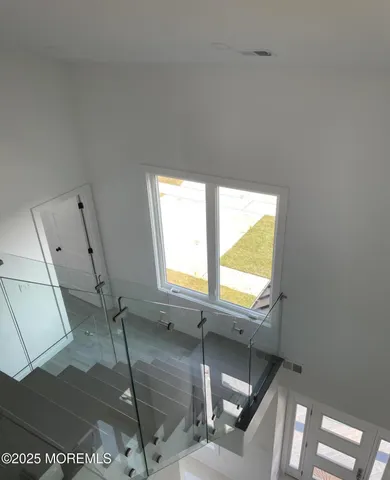 a view of an empty room and a window