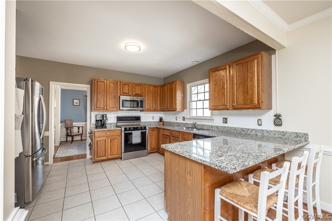 13900 Sagebrook Road Midlothian, VA 23112 - Photo 11 of 44 a kitchen with a sink a counter top space and stainless steel appliances