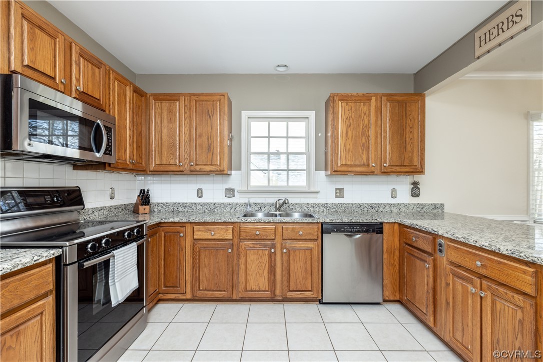 13900 Sagebrook Road Midlothian, VA 23112 - Photo 12 of 44 a kitchen with stainless steel appliances granite countertop a stove sink and cabinets