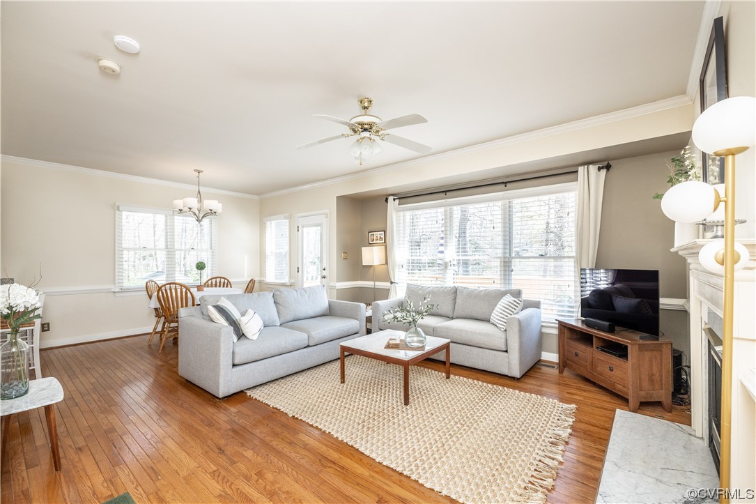 13900 Sagebrook Road Midlothian, VA 23112 - Photo 15 of 44 a living room with furniture a fireplace and a large window