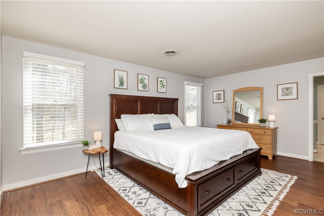 13900 Sagebrook Road Midlothian, VA 23112 - Photo 20 of 44 a bed sitting in a bedroom next to a window