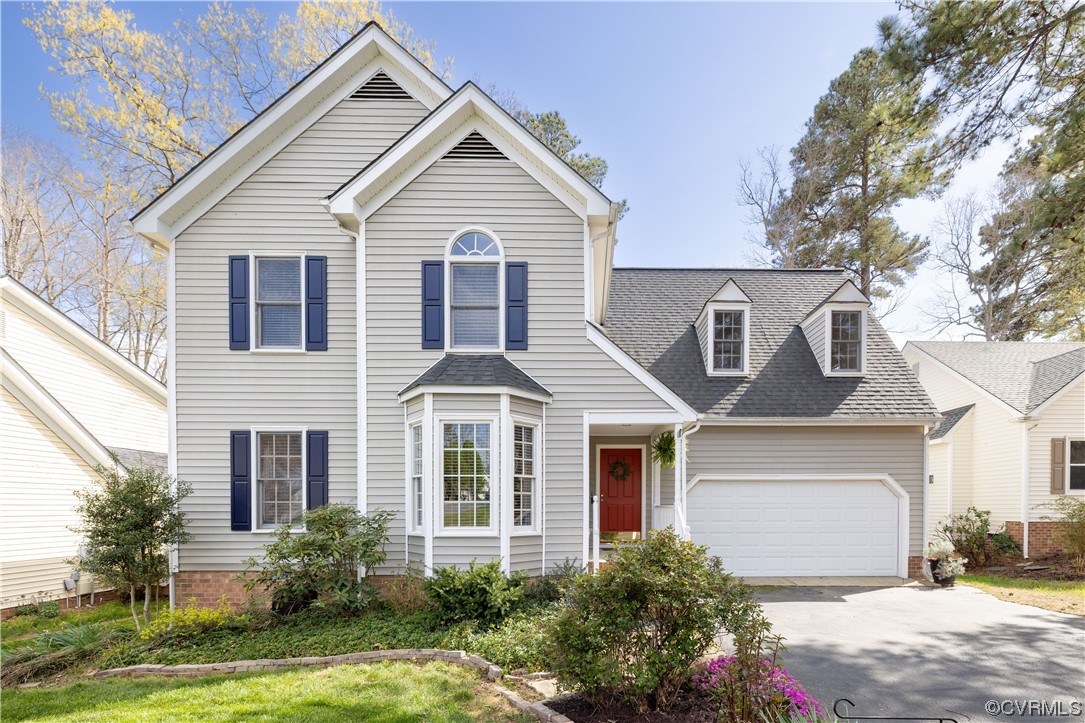 13900 Sagebrook Road Midlothian, VA 23112 - Photo 2 of 44 a front view of a house with a yard and garage