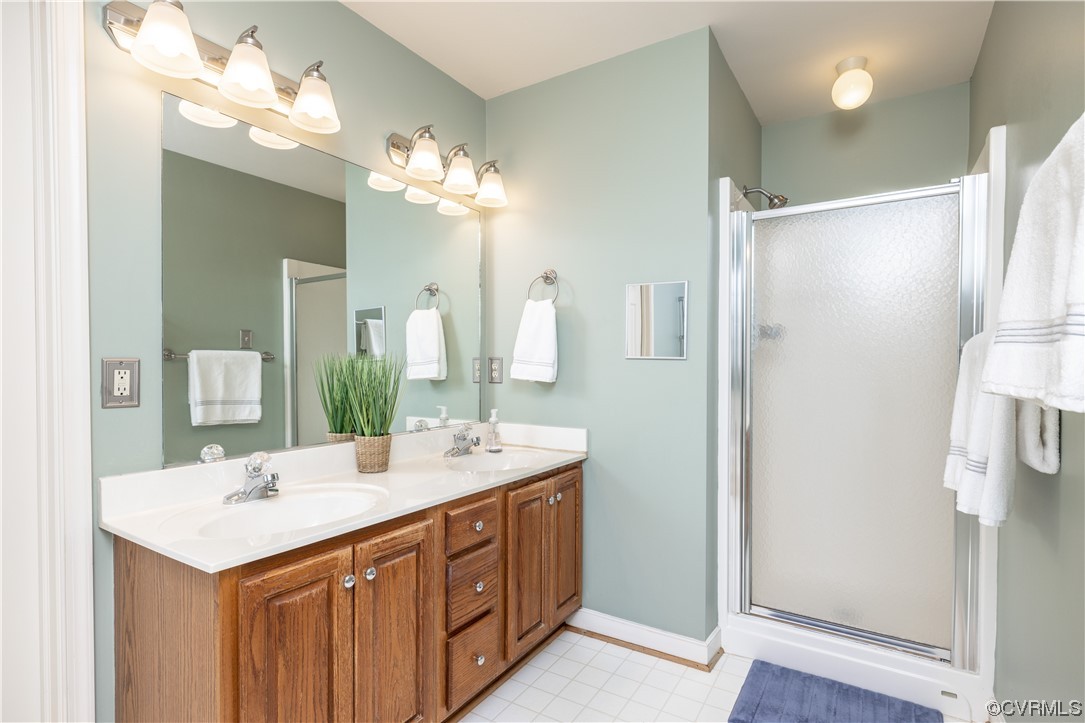 13900 Sagebrook Road Midlothian, VA 23112 - Photo 22 of 44 a bathroom with a double vanity sink and a mirror