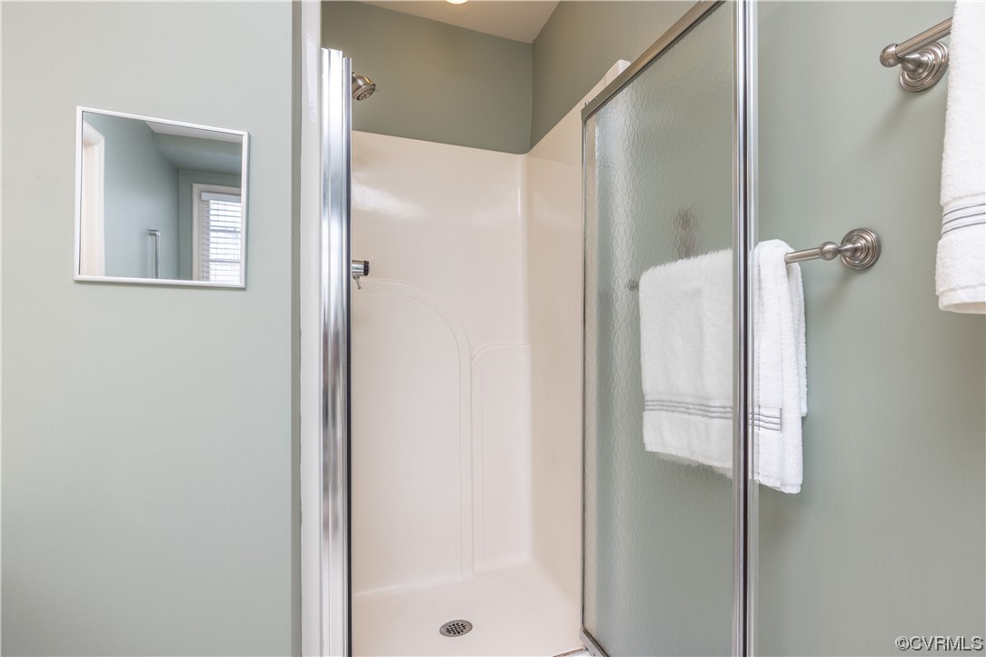13900 Sagebrook Road Midlothian, VA 23112 - Photo 25 of 44 a bathroom with a glass shower door and a mirror