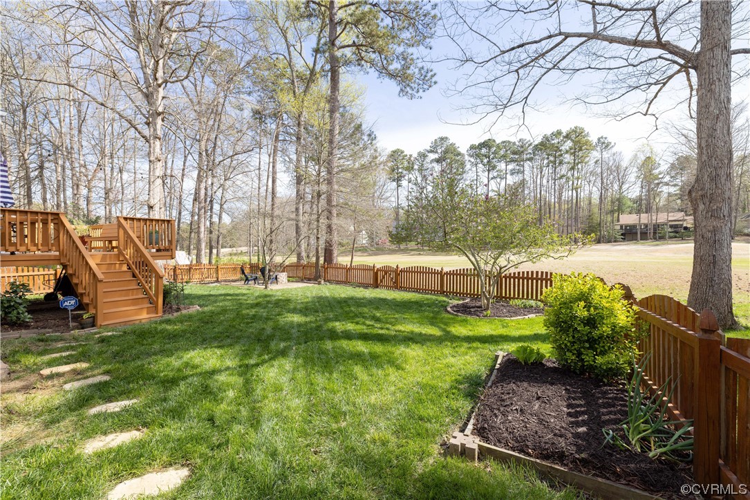 13900 Sagebrook Road Midlothian, VA 23112 - Photo 36 of 44 a view of a garden with a bench