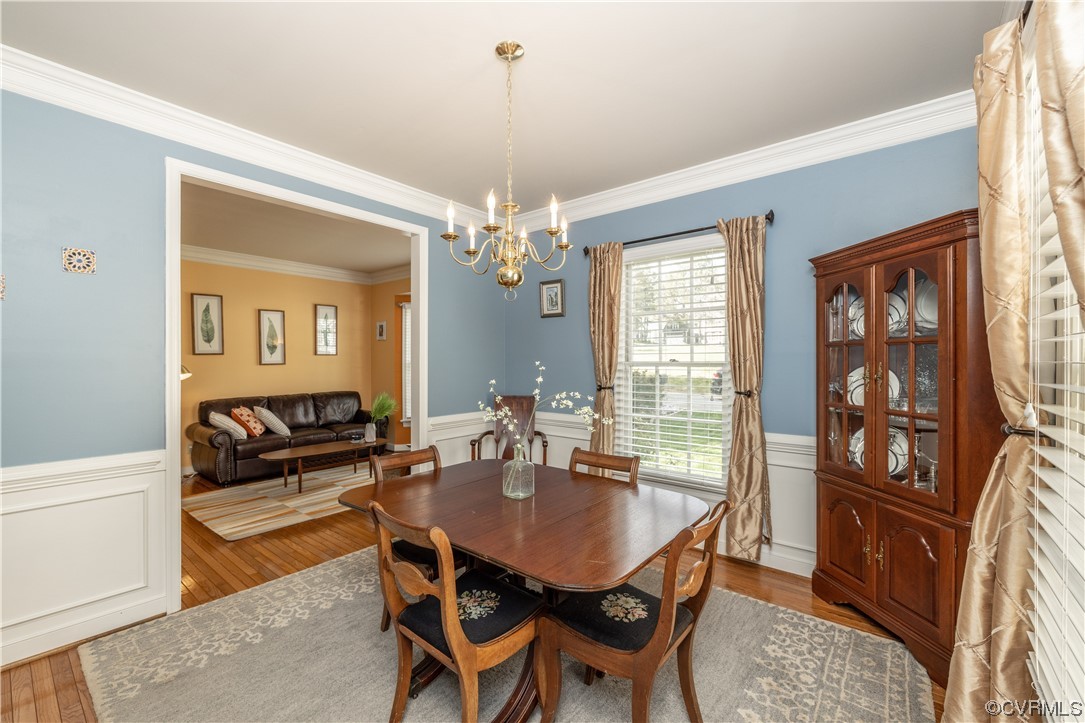 13900 Sagebrook Road Midlothian, VA 23112 - Photo 8 of 44 a view of a dining room with furniture and chandelier