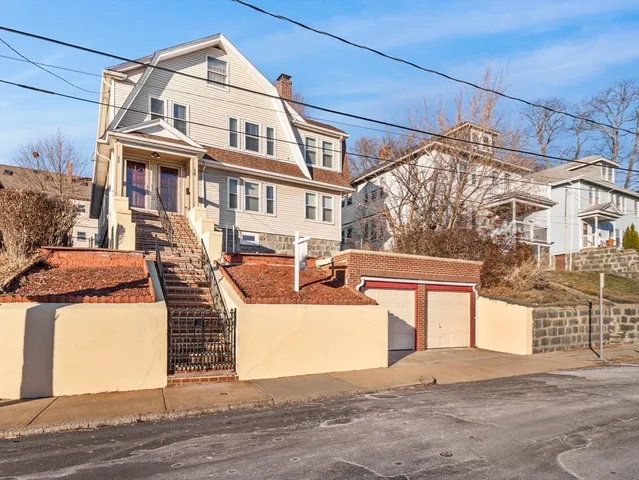 a view of a white building among the street