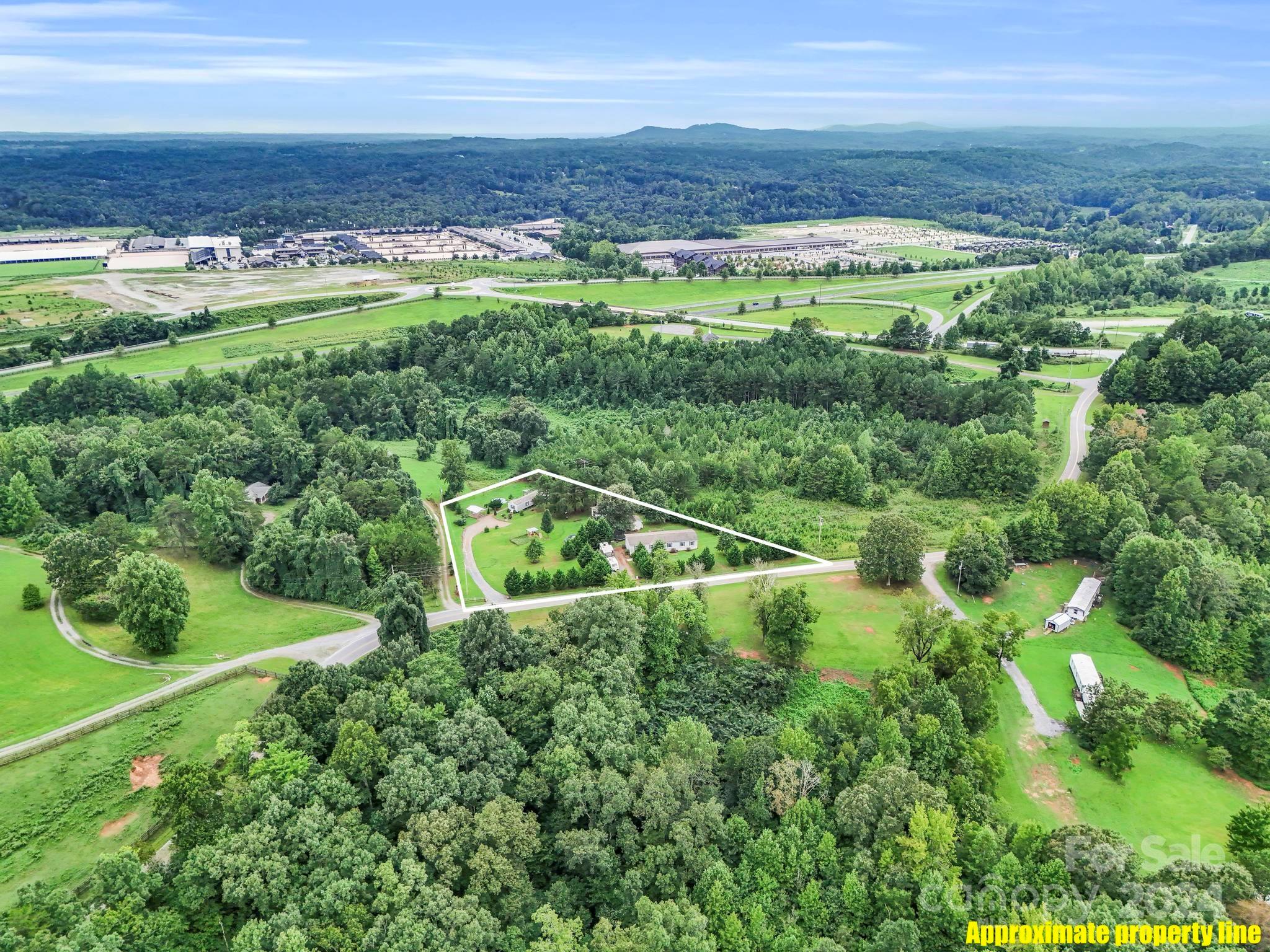 246 Abrams Moore Road Rutherfordton, NC 28139 - Photo 45 of 46 a view of a lush green field with lots of plants and trees